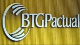 Fachada de fundo amarelo com a logo do BTG Pactual