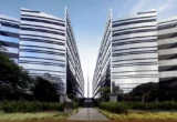 Imagem mostra duas torres corporativas lado a lado.