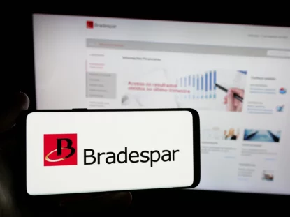 Tela de celular com logo da Bradespar (BRAP3), com site da companhia ao fundo. 