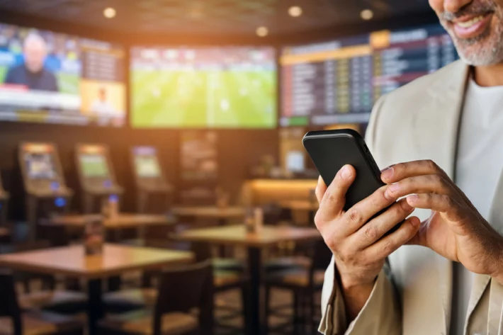 Mercados de previs&atilde;o como Kalshi e Polymarket enfrentam cassinos e sportsbooks nos EUA em disputa legal sobre apostas esportivas. (Imagem: Adobe Stock) 