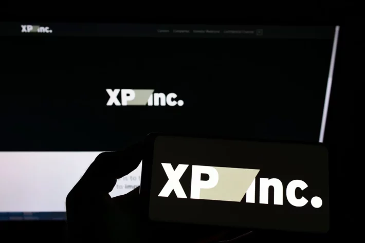 XP registra lucro de R$ 1,318 bilh&atilde;o no primeiro trimestre de 2026, impulsionada por renda vari&aacute;vel e atacado. (Imagem: Adobe Stock)